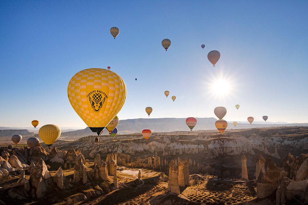 Hot air balloons flying over Cappadocia at sunrise,
Cappadocia hot air balloon ride above fairy chimneys,
Tourists enjoying a magical balloon flight in Cappadocia, Cappadocia hot air balloon rides,
Cappadocia balloon tour,
Hot air balloon flights Cappadocia
,Luxury Cappadocia balloon tour,
Exclusive balloon ride Cappadocia,
Best hot air balloon Cappadocia,
Cappadocia sunrise balloon tour,
Fairy chimney hot air balloon ride,cappadocia hot air balloon price 2025 , cappadocia balloon flight price 2025 , capppadocia balloon booking price , göreme balloon ride , cappadocia balloon ride price 2025, hot air balloon turkey , cappadocia turkey hot air balloon rides,